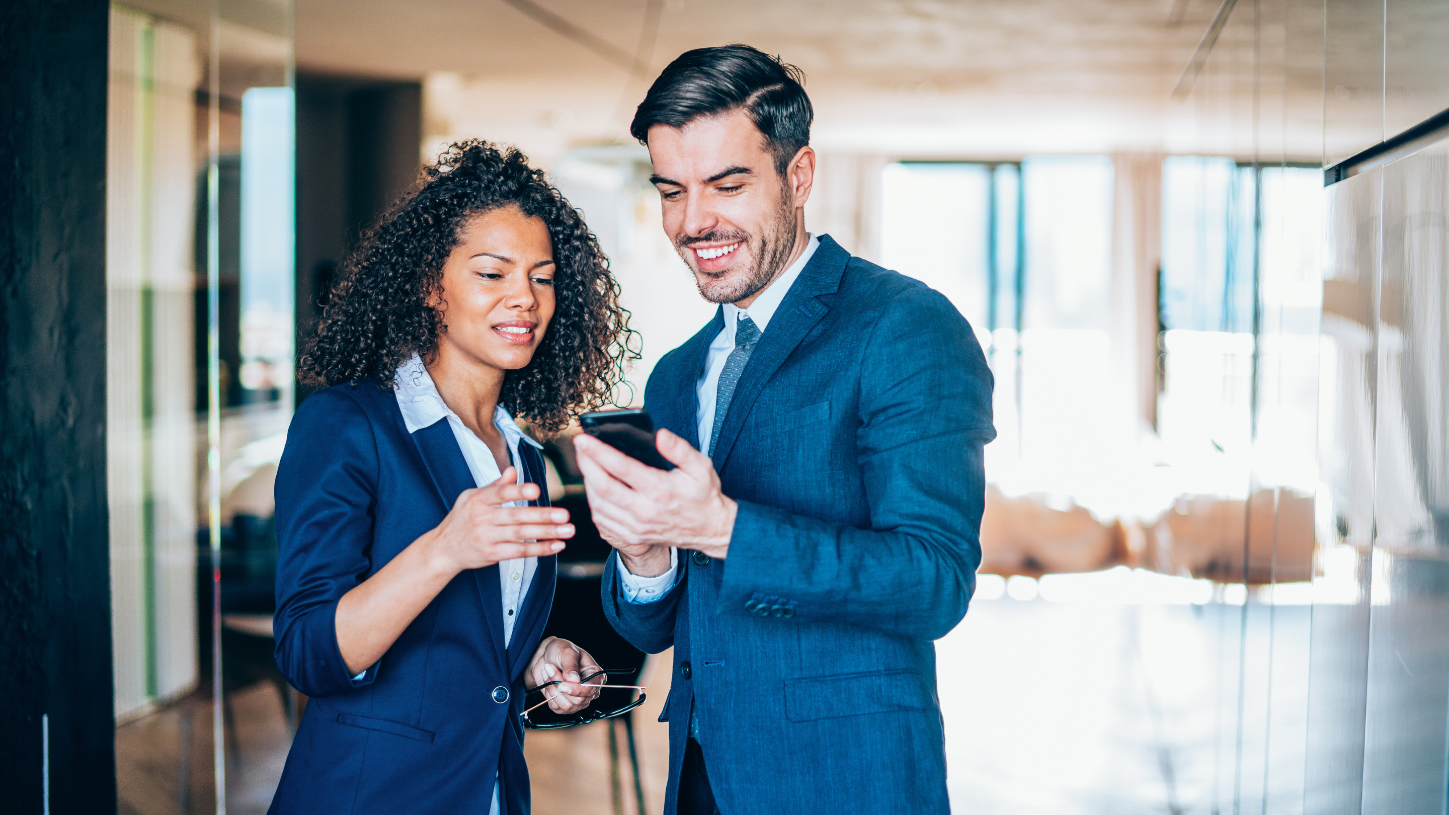 Female and male looking at QR code scanned credential